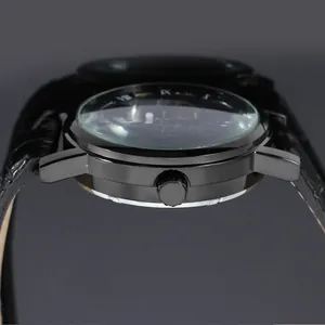 Side profile view of a mechanical watch with black leather strap and domed crystal