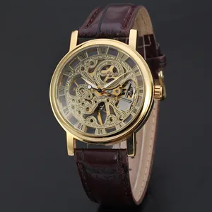 Detailed close-up of T-Winner gold skeleton mechanical watch with brown leather strap