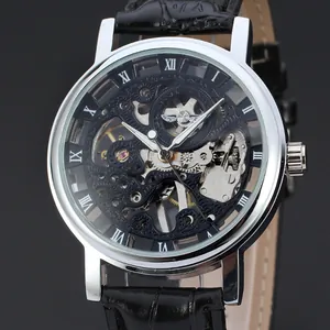Close-up of T-Winner skeleton mechanical watch with silver case and black leather strap.