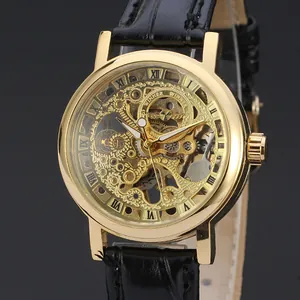 Detailed close-up of T-Winner golden skeleton mechanical watch with leather strap