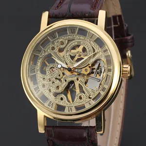 Detail view of T-Winner golden skeleton mechanical watch featuring a brown leather strap