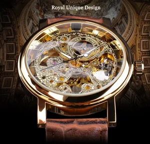 Detailed macro view of T-Winner luxury gold skeleton mechanical watch face with leather strap.