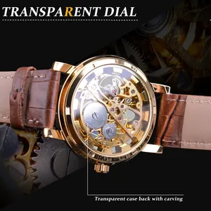 Exquisite detail of gold T-Winner skeleton mechanical watch with brown leather strap