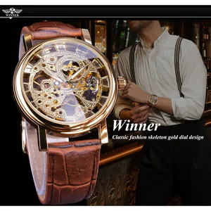 Vintage T-Winner skeleton mechanical watch featuring gold dial and brown leather strap