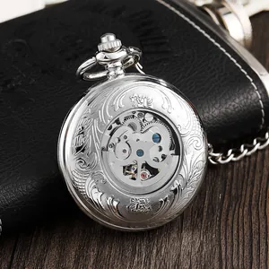 Detailed view of silver mechanical pocket watch with skeleton back and floral engraving