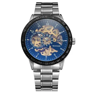 Close-up detail of the golden mechanical movement and blue dial of T-WINNER watch