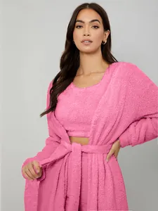 Close-up of pink 3-piece plush loungewear set featuring a robe and crop top