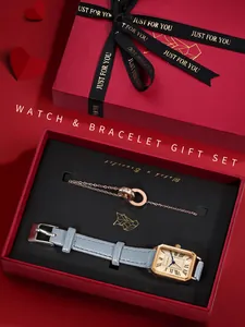 Elegante vintage horloge- en armbandset in een luxe rode geschenkverpakking.