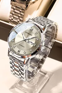 Detail view of GOOBASEN men's luxury silver watch with a diamond-set champagne dial