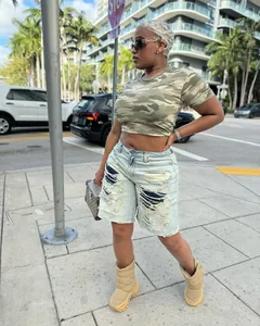 Street style washed distressed ripped denim shorts with unique patchwork details and raw hem