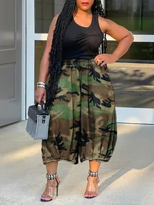 Detailed view of women's camouflage print lantern pants with elastic waist and cropped length