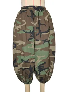Detailed view of camouflage print lantern pants with elastic waist and cropped cut.