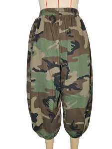 Detail view of casual camouflage print harem pants featuring an elastic waist and capri length