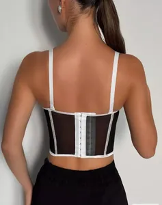 Back view of a black mesh corset top with white contrast trim and hook-eye fastener