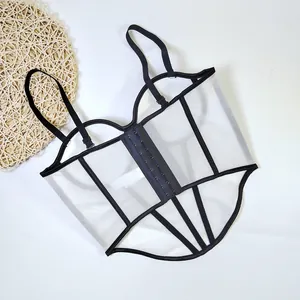 Detailed view of a sexy white mesh corset top with black fishbone contrast piping detail