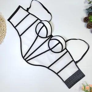 Detailed view of sexy white mesh corset top with black contrast boning and straps