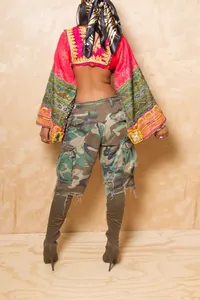 Back view of trendy distressed camouflage cargo shorts with ripped details for women