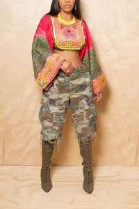 Trendy women's distressed camouflage cargo shorts with a loose fit and ripped details