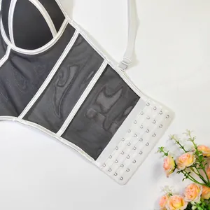 Detailed close-up of multi-row hook closure on women's mesh fishbone corset top