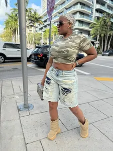 Trendy street style distressed denim shorts with ripped patchwork design for women