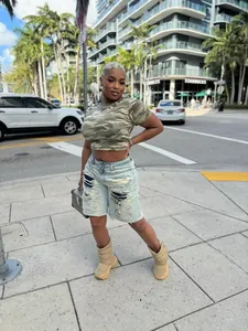 Women's distressed denim Bermuda shorts with patchwork in a trendy street style