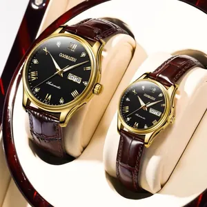 Close-up view of GOOBASEN gold automatic couple watches with brown leather straps in a box