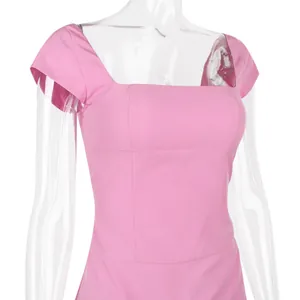Close-up view of the square neckline and sleeve detail of a pink slim-fit dress.