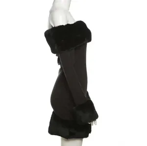 Détail d'une robe noire à épaules dénudées avec élégante garniture en fausse fourrure