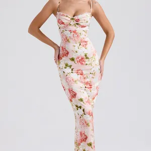 Close-up of floral print maxi dress with delicate lace trim and ruched bust detail