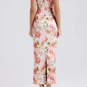 Rear view of pink floral milk silk maxi dress with back slit and slim silhouette
