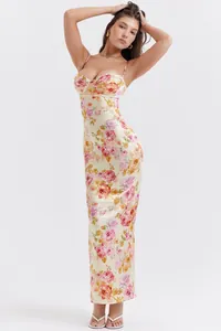 Detailed view of floral slim-fit maxi dress with lace trim and gathered chest design