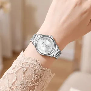 Elegant Goobasen silver metal women's quartz watch featuring a date window and Roman numerals