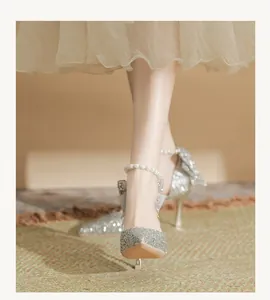 Silver glitter high heels with pearl ankle strap for elegant wedding dress look