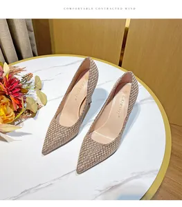 Detailed close-up showing the elegant woven texture of pointed toe stiletto high heels
