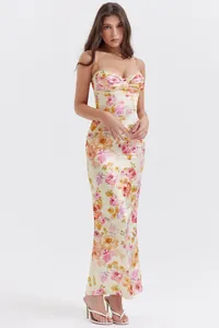 Detail of floral print slim-fit maxi dress with lace trim and pleated bust design.