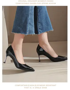 Side view of elegant black patent leather pointed-toe high heels on model's feet