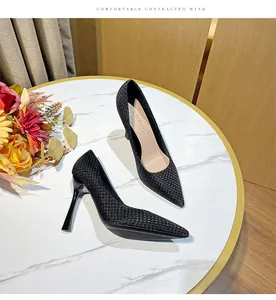 Macro view of elegant black woven texture on these pointed-toe stiletto high heels