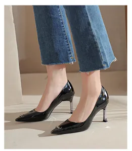 Elegant black patent leather pointed toe pumps featuring unique transparent high heels