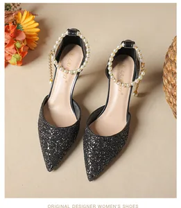 Elegant black glitter pointed-toe high heels with luxurious pearl ankle strap detail