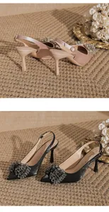 Elegant pointed toe slingback heels featuring large crystal bow details in two colors.