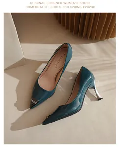 Elegant teal patent leather pointed-toe pumps featuring stylish metallic toe caps and heels