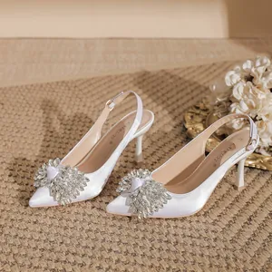 Elegant white satin pointed-toe slingback high heels decorated with crystal rhinestone clusters