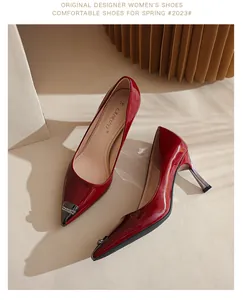 Elegant red patent leather pointed-toe high heels with rhinestone toe cap details