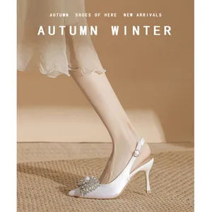 Elegant white satin slingback high heels with luxury crystal buckle for evening events