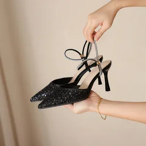 Elegant black glitter pointed-toe high heels with sparkling rhinestone ankle straps