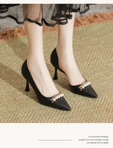 Elegant black pointed-toe stiletto heels with pearl chain strap worn by an Asian model.