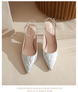 Detailed close-up of elegant silver glitter pointed-toe slingback pumps for women