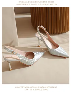 Detail of silver tiger-print pointed-toe slingback high heels with slim heel design.