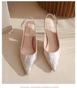 Top view of elegant silver glitter slingback pumps featuring slim stiletto heels.