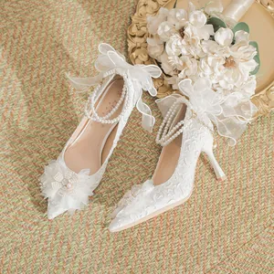 Elegant French style white bridal lace stiletto heels featuring pearls and bows